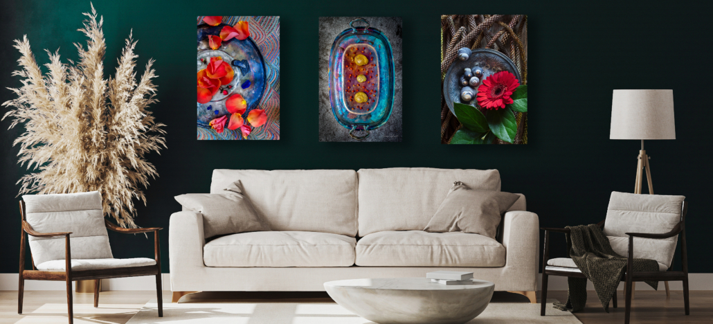 Image of three silver platters on green wall with couch