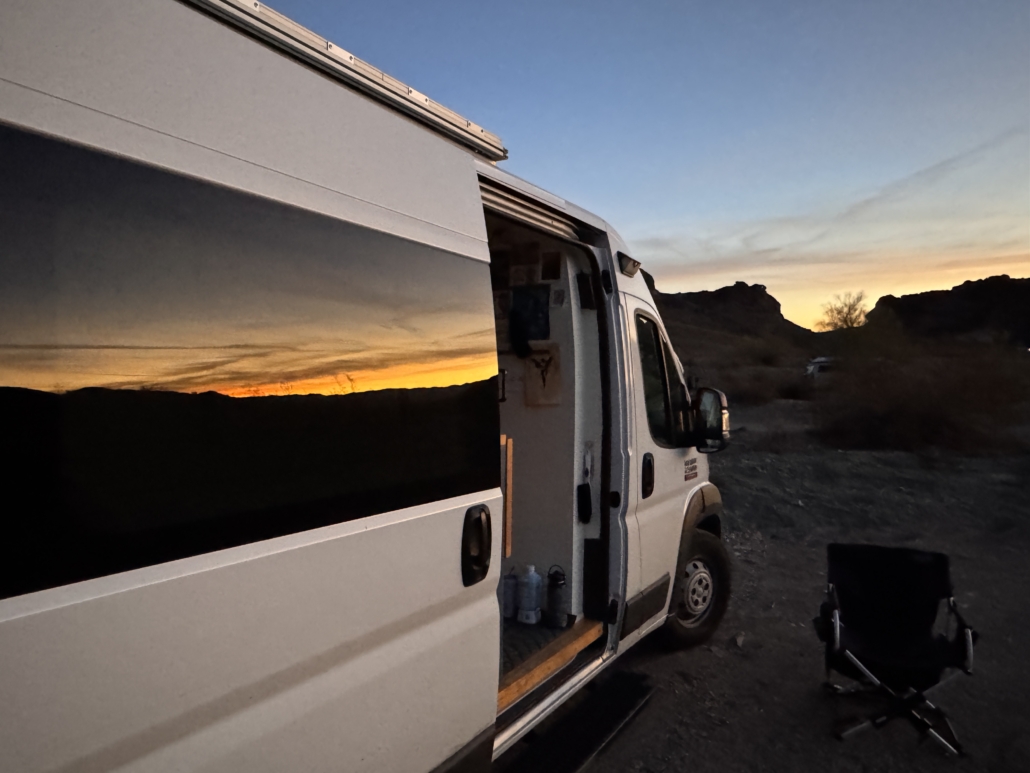 Van reflecting sunset