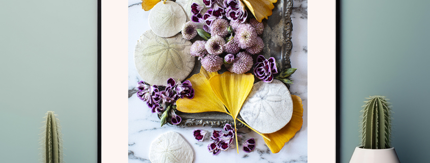 Image of a sliver platter with ginko leaves and purple flowers